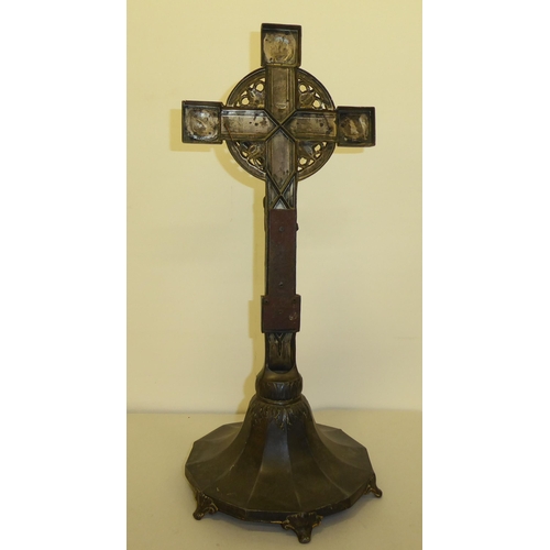 346 - A cast metal freestanding crucifix, decorated with floral designs and bearing the inscription INRI&n... 