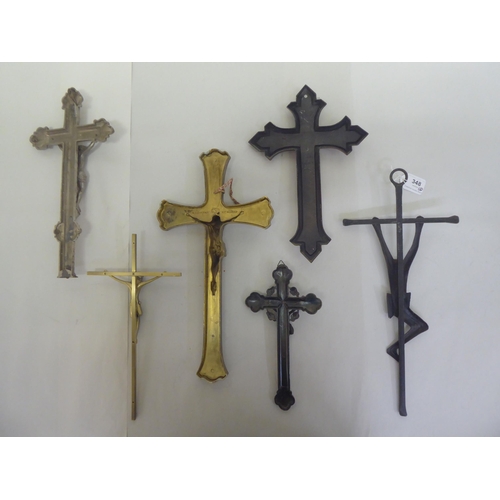 348 - Six cast metal crucifixes  varying designs & sizes  largest 16