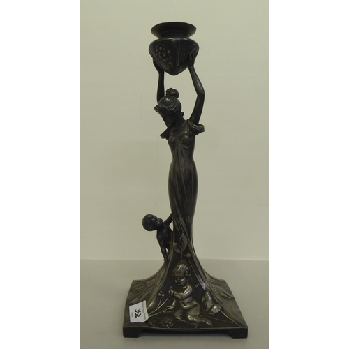 362 - An Art Nouveau pewter lamp base, fashioned as a woman holding a vase  14