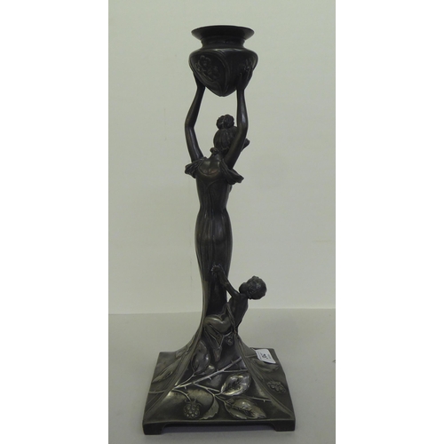 362 - An Art Nouveau pewter lamp base, fashioned as a woman holding a vase  14