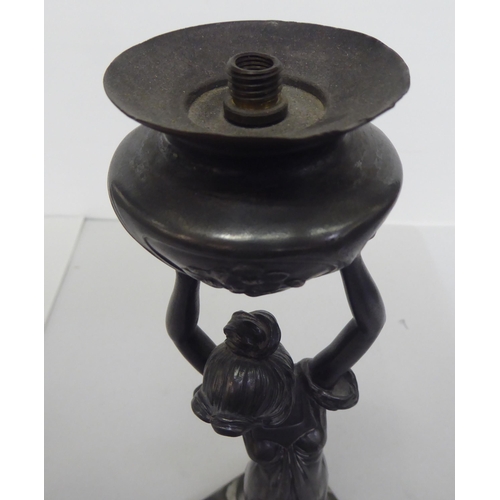 362 - An Art Nouveau pewter lamp base, fashioned as a woman holding a vase  14