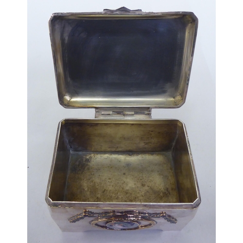 367 - An early 20thC silver plated box with a hinged lid and enamel decoration, depicting a girls' head  4... 