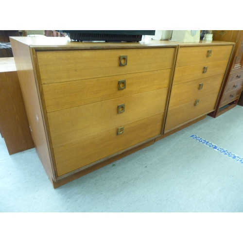 369 - A pair of G-Plan teak graduated, four drawer dressing chests, on plinths  28