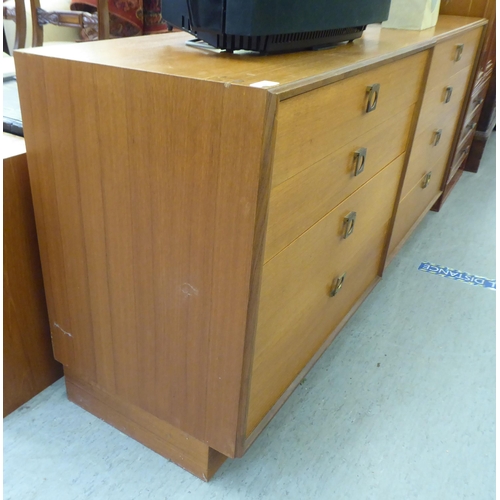 369 - A pair of G-Plan teak graduated, four drawer dressing chests, on plinths  28