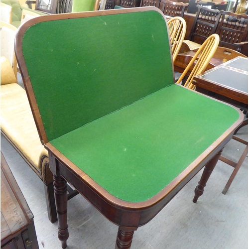 371 - A late Victorian mahogany card table, the foldover top raised on ring turned legs  30