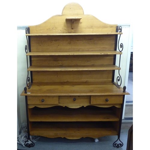 372 - A modern oak and wrought iron mounted dresser with an arrangement of staggered open shelves  76... 