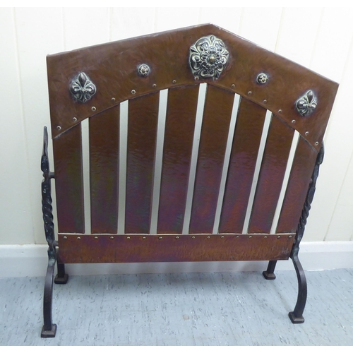 376 - An Arts & Crafts riveted copper and cast iron firescreen, designed as a car radiator grill  25