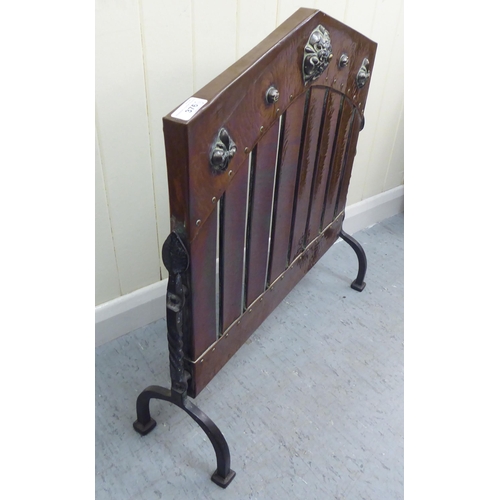 376 - An Arts & Crafts riveted copper and cast iron firescreen, designed as a car radiator grill  25