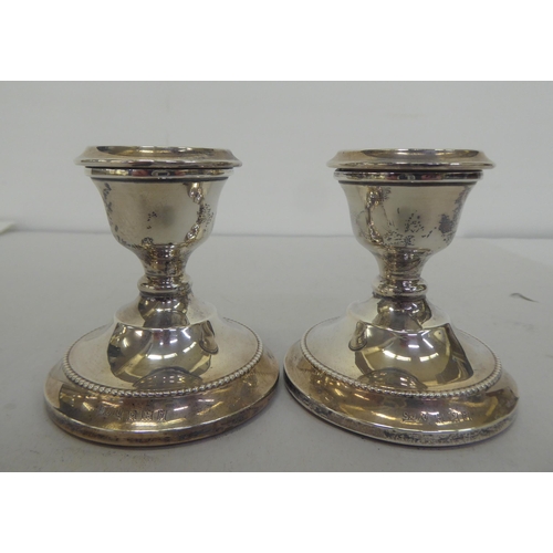 379 - Silver collectables: to include a pair of dwarf candlesticks  3