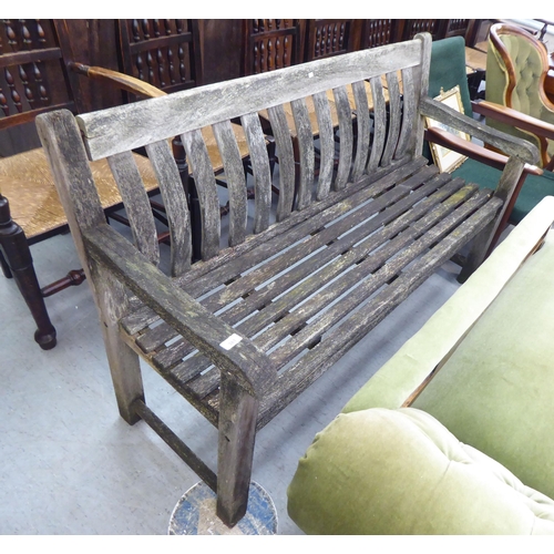 381 - A slatted weathered teak garden bench  59