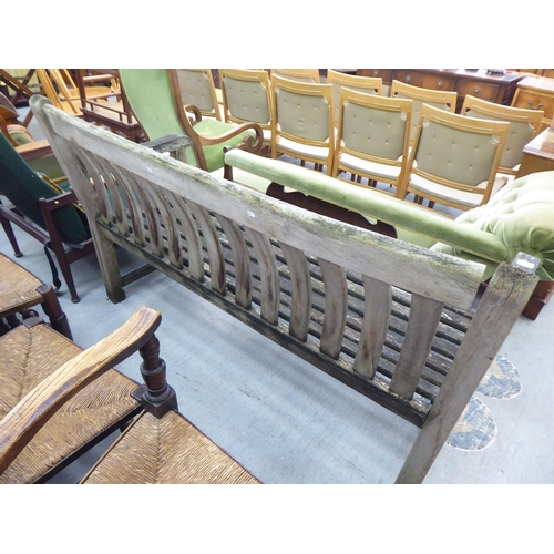 381 - A slatted weathered teak garden bench  59