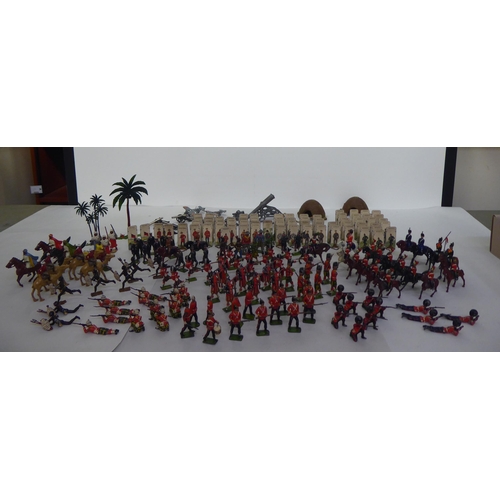 385 - Britains and other painted metal Zulu warriors, soldiers and accessories