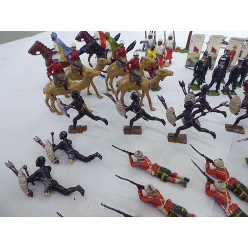 385 - Britains and other painted metal Zulu warriors, soldiers and accessories