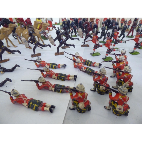 385 - Britains and other painted metal Zulu warriors, soldiers and accessories