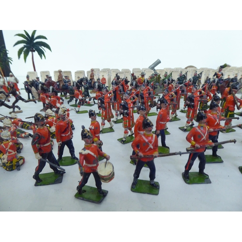 385 - Britains and other painted metal Zulu warriors, soldiers and accessories