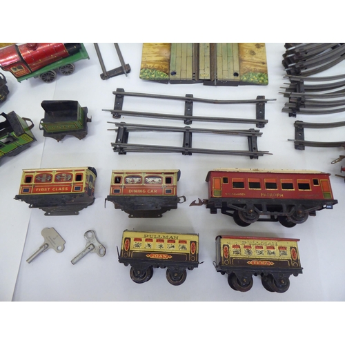 391 - Vintage Meccano and other tinplate model railway related accessories: to include a Pullman coach