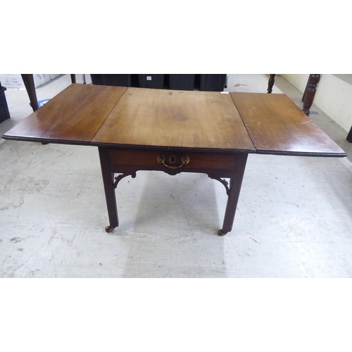 73 - A late 19thC mahogany drop leaf occasional table, raised on square legs and casters  17