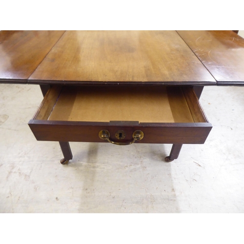 73 - A late 19thC mahogany drop leaf occasional table, raised on square legs and casters  17