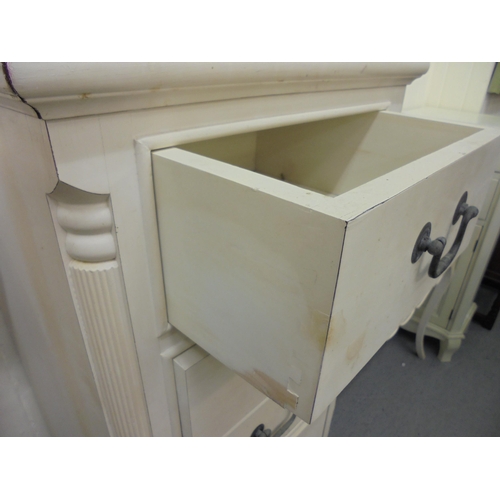 143 - Three items of modern cream painted bedroom furniture, viz. a Laura Ashley cupboard  43