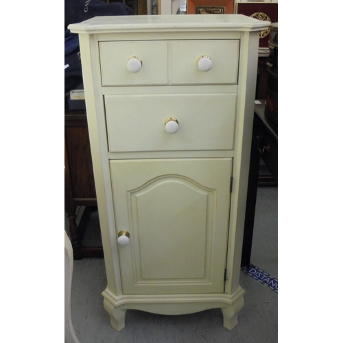 143 - Three items of modern cream painted bedroom furniture, viz. a Laura Ashley cupboard  43