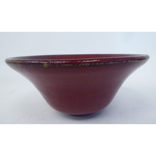 93 - A modern china drip glazed oxblood coloured pottery bowl with a flared rim  7