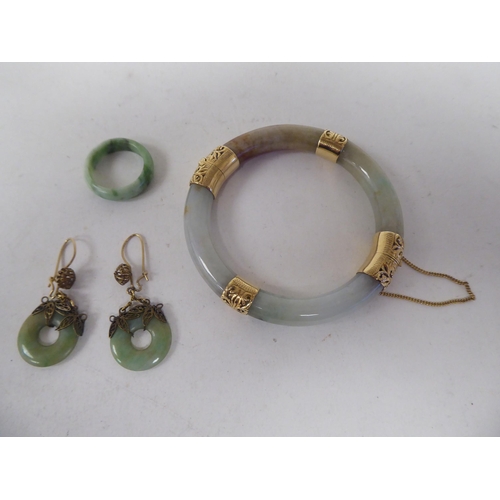 11 - Jade jewellery: to include a bangle with yellow metal mounts
