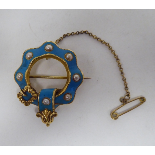 119 - A yellow metal, pearl and blue enamel brooch