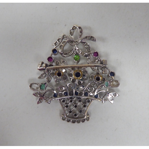 120 - An Edwardian style white metal brooch, set with diamonds and coloured stones, fashioned as a bunch o... 