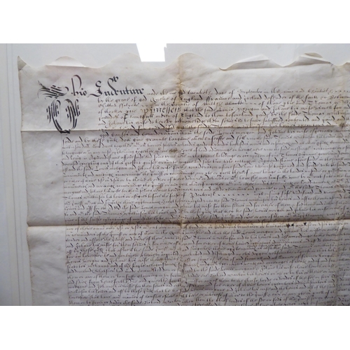 125 - An Elizabethan handwritten indenture, relating to land and cottages, located in Amersham, dated 1597... 