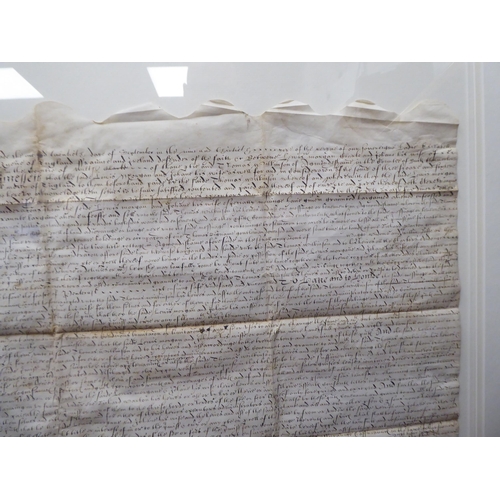 125 - An Elizabethan handwritten indenture, relating to land and cottages, located in Amersham, dated 1597... 