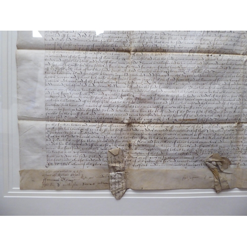 125 - An Elizabethan handwritten indenture, relating to land and cottages, located in Amersham, dated 1597... 