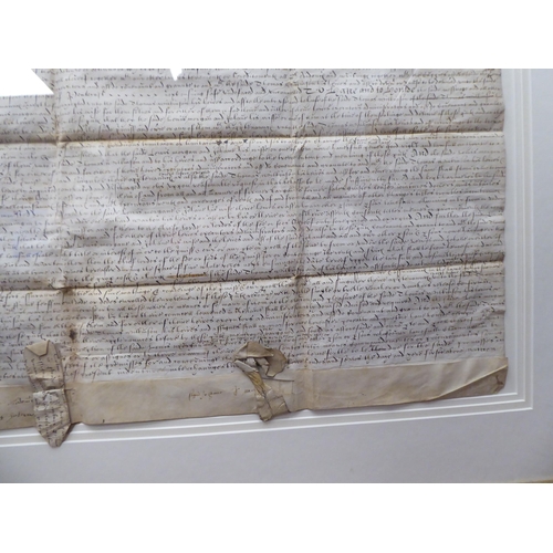 125 - An Elizabethan handwritten indenture, relating to land and cottages, located in Amersham, dated 1597... 