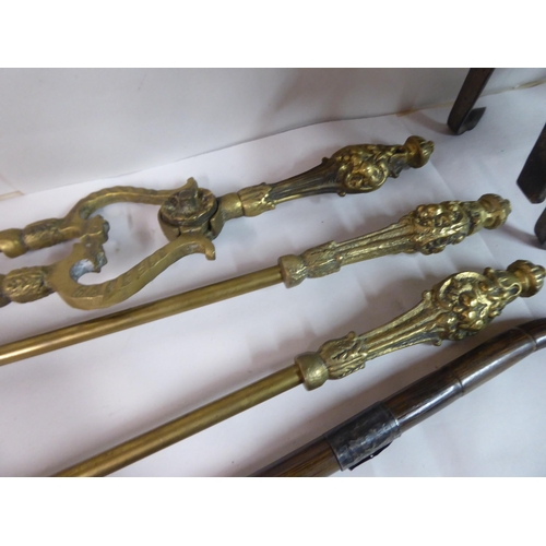 139 - Metalware: to include an early 19thC brass trivet, raised on splayed feet  8