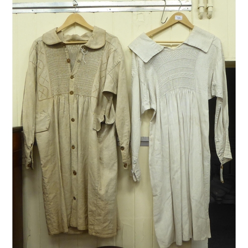 140 - Two late Victorian white linen smocks