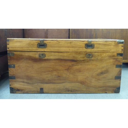 166 - A late 19th/early 20thC Anglo-Indian boarded camphorwood chest with brass reinforcement, recessed, f... 