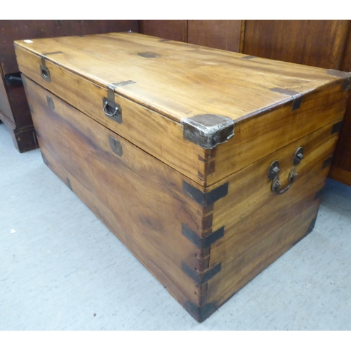 166 - A late 19th/early 20thC Anglo-Indian boarded camphorwood chest with brass reinforcement, recessed, f... 