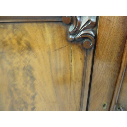 170 - A late Victorian mahogany cabinet bookcase with a straight cornice, over a pair of full-height, carv... 