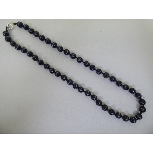 182 - A banded agate uniform bead necklace, on a ring bolt clasp