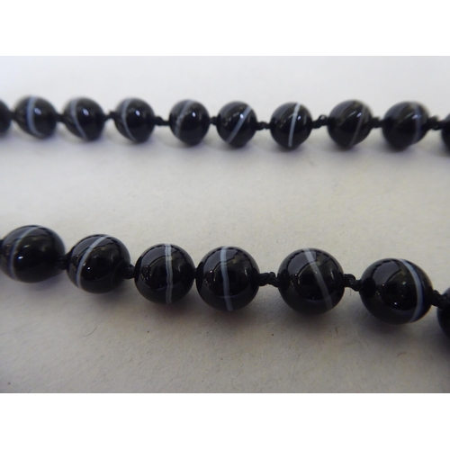 182 - A banded agate uniform bead necklace, on a ring bolt clasp