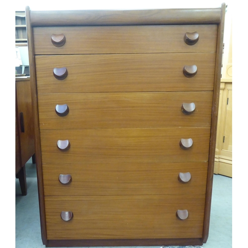 185 - A 1970s teak tallboy, comprising six graduated long drawers with grab handles  42