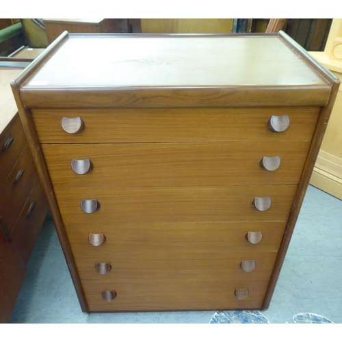 185 - A 1970s teak tallboy, comprising six graduated long drawers with grab handles  42