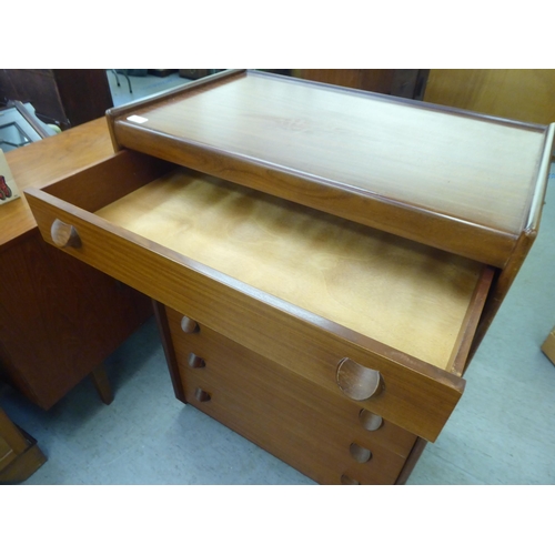 185 - A 1970s teak tallboy, comprising six graduated long drawers with grab handles  42