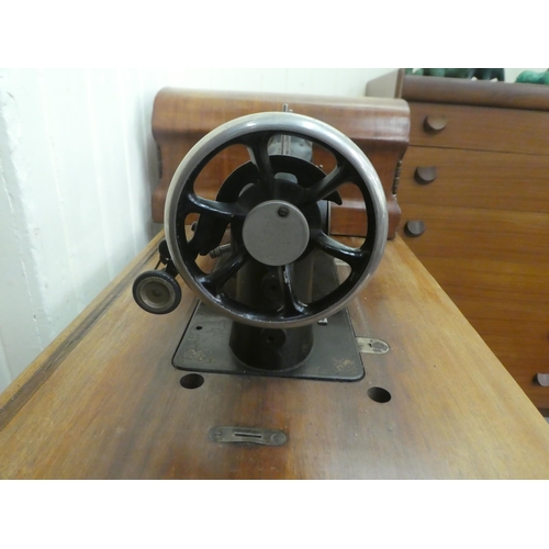 198 - A vintage Simanco sewing machine, set in a cast iron treadle frame  29