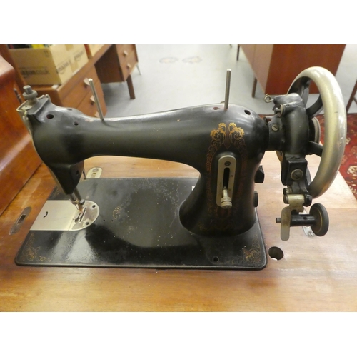 198 - A vintage Simanco sewing machine, set in a cast iron treadle frame  29