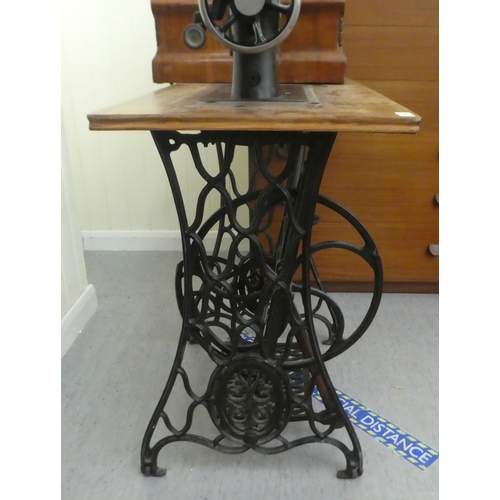 198 - A vintage Simanco sewing machine, set in a cast iron treadle frame  29