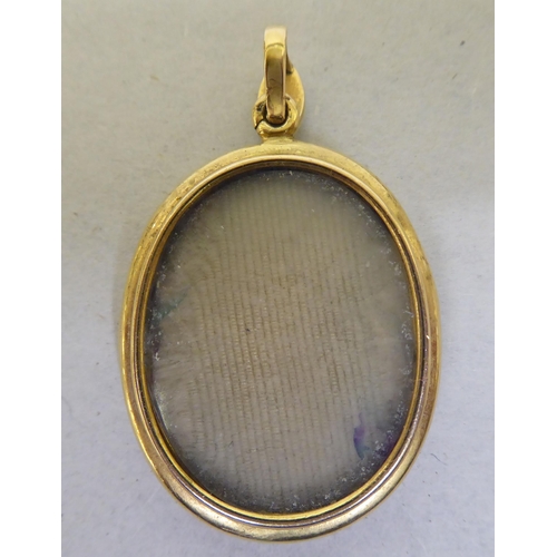 199 - A mid Victorian yellow metal, hinged locket, set with diamonds, pearls and turquoise stones 