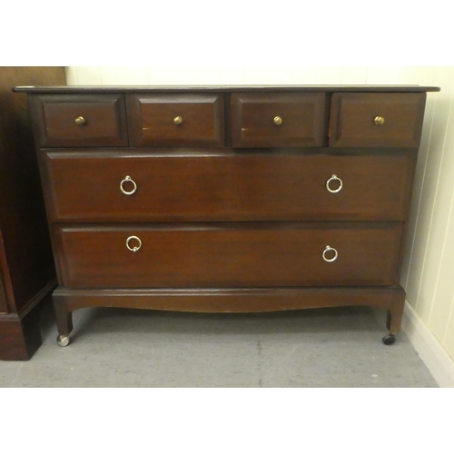 200 - A Stag Minstrel style mahogany six drawer dressing chest, raised on bracket feet  28