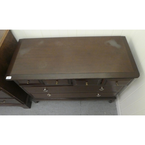 200 - A Stag Minstrel style mahogany six drawer dressing chest, raised on bracket feet  28