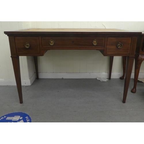 205 - An Edwardian string inlaid mahogany three drawer desk, raised on square, tapered legs  30