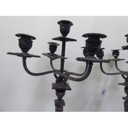 208 - A pair of early 20thC silver plated, five branch candelabra, each on a pedestal base  19